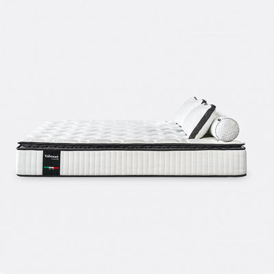Elegant-looking and comfortable valmori mattress with pillows on a white background